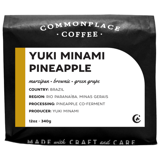 A 12oz matte black bag of Yuki Minami Pineapple from Commonplace Coffee. 
