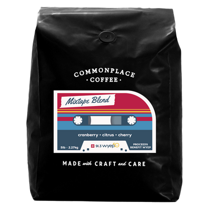 A black bag of 5lb Mixtape Blend from Commonplace Coffee. The label is red, yellow, and blue, and looks like a retro cassette tape.